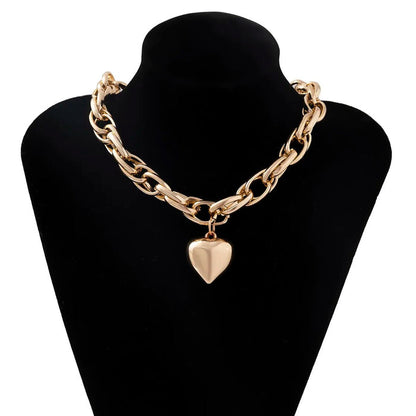 Oversized heart pendant necklace with chunky chain, gold color