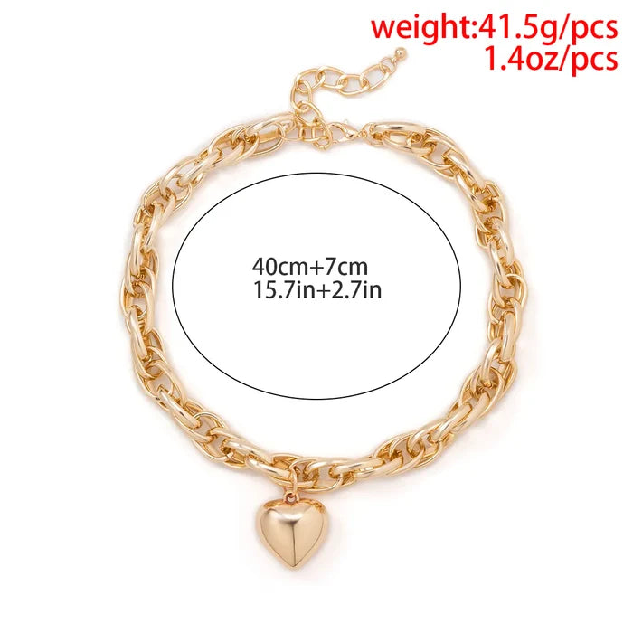 Oversized heart pendant necklace with chunky chain, gold color