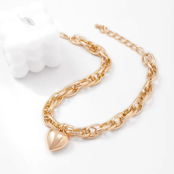 Oversized heart pendant necklace with chunky chain, gold color