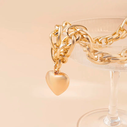 Oversized heart pendant necklace with chunky chain, gold color