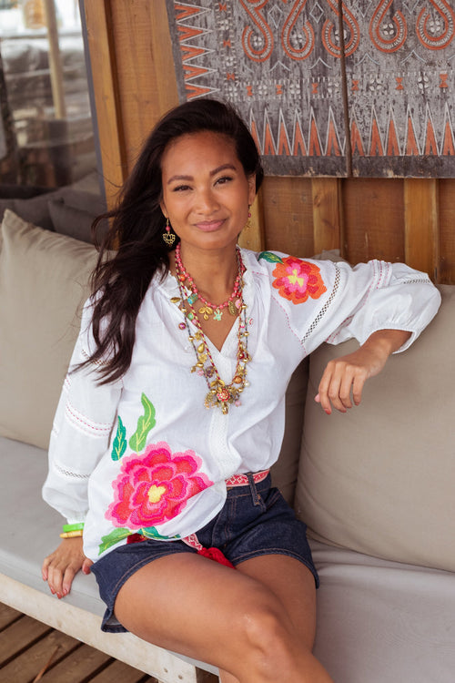 Model wearing Place Du Soleil White Blouse With Large Embroidered Flower S26-339 by Place du Soleil, shop Place du Soleil at Dotique