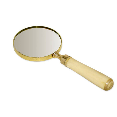 Magnifying glass with gold frame and beige handle on a white background