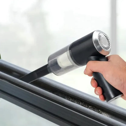 a person using a window cleaner to clean the glass