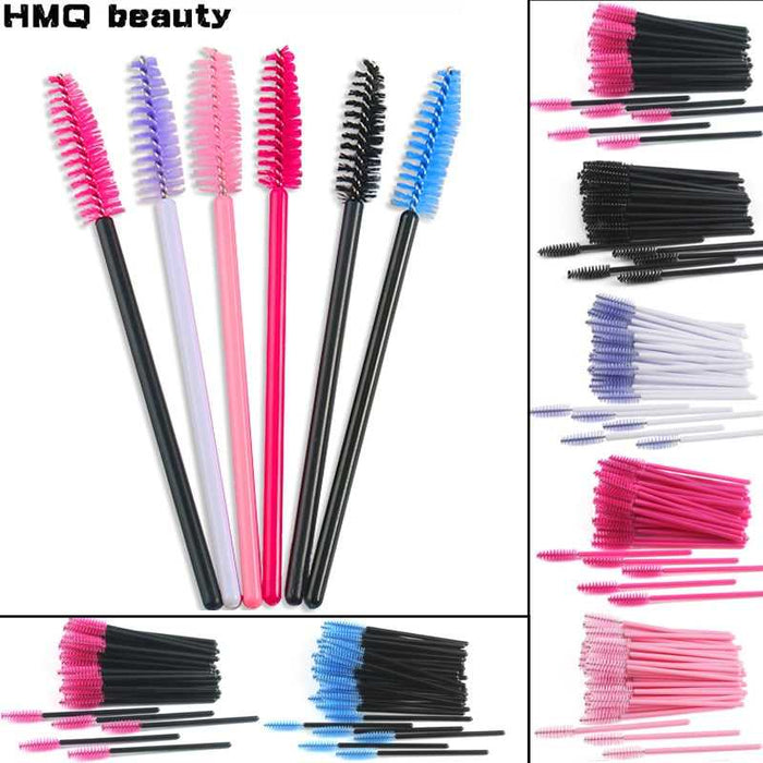 A collection of disposable eyelash brushes in various colors including black, pink, purple, blue, and white, with plastic handles.