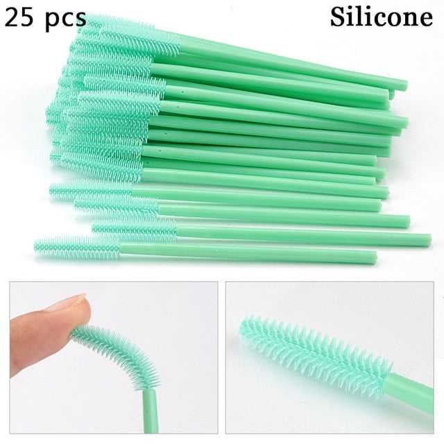 A collection of disposable eyelash brushes in various colors including green, black, pink, purple, blue, and white, with plastic handles.