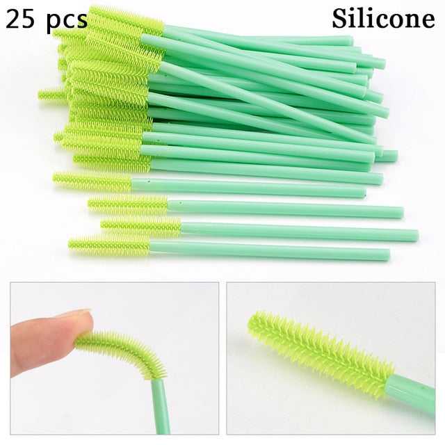 A collection of disposable eyelash brushes in various colors including black, pink, purple, blue, and white, with plastic handles.