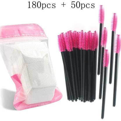 A collection of disposable eyelash brushes in various colors including black, pink, blue, and white, with plastic handles.