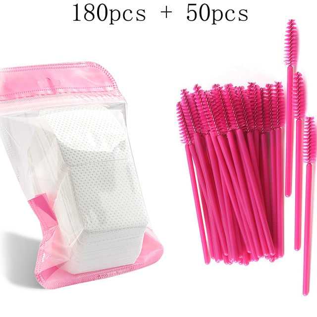 A collection of disposable eyelash brushes in various colors including pink,, and white, with plastic handles.