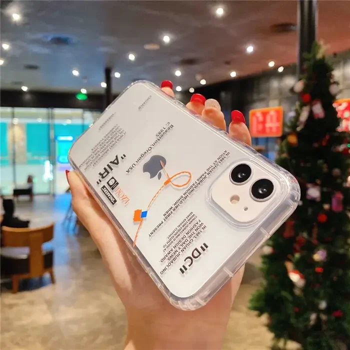 A hand holding a clear case with a camera attached to it