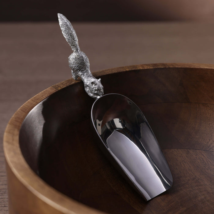 St. Anton Pewter Squirrel Design Ice Scoop resting on a wooden bowl, featuring a detailed squirrel handle.