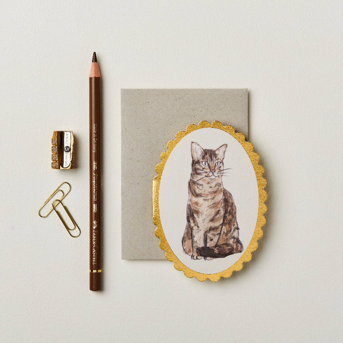 Greeting card with a cat illustration and gold foiled scalloped edges.