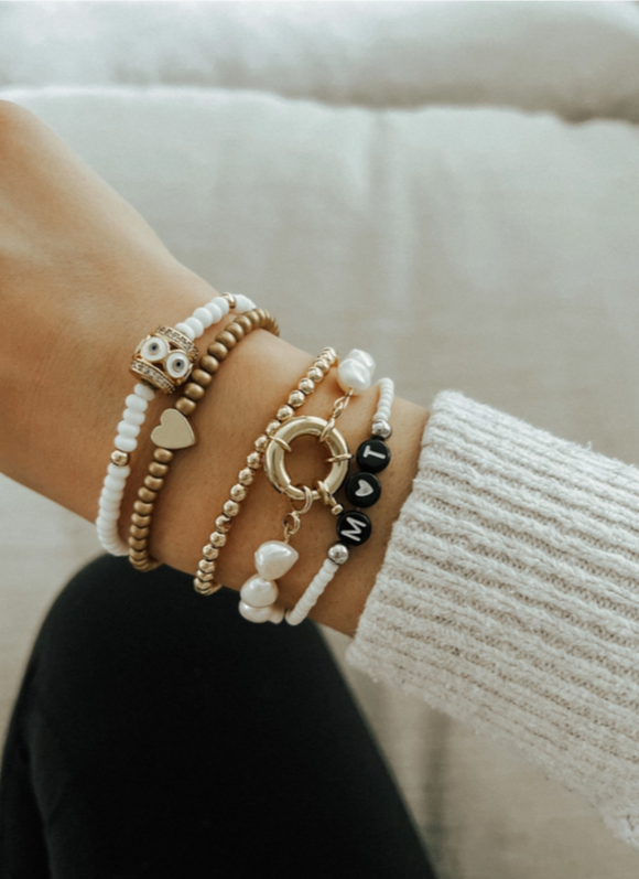 Canadian made pearl bracelet with gold nautical clasp.