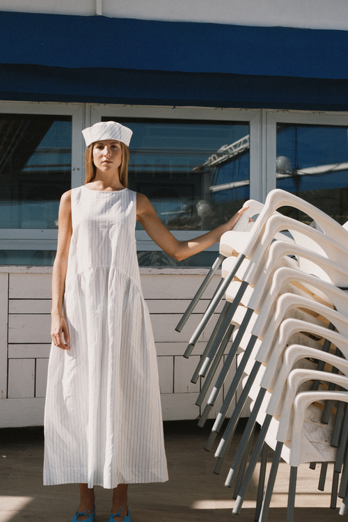 Tiny Big Sister striped cotton dress with a low back detail and relaxed summer fit. Light, flattering and easy to wear. Shop at Dotique.