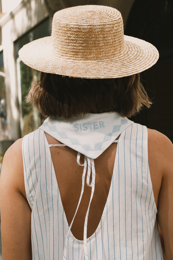 Tiny Big Sister striped cotton dress with a low back detail and relaxed summer fit. Light, flattering and easy to wear. Shop at Dotique.