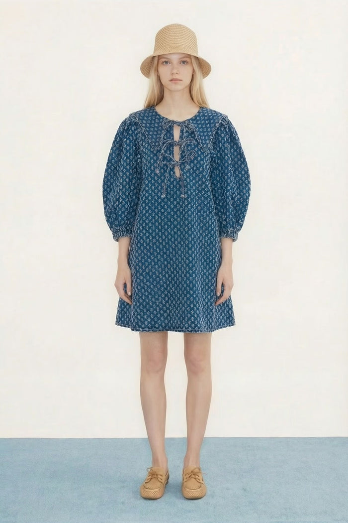 Model wearing Tiny Big Sister Puff Sleeves Denim Dress with lace-up detail by Tiny Big Sister, shop Tiny Big Sister at Dotique gallery 1