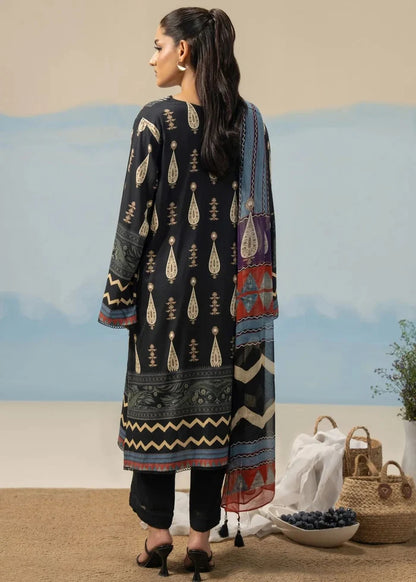 Women's printed 3-piece suit back: black tunic with repeating gold motifs and striped dupatta