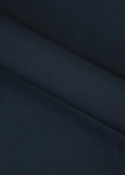 Dark black wash-and-wear fabric close-up with smooth drape
