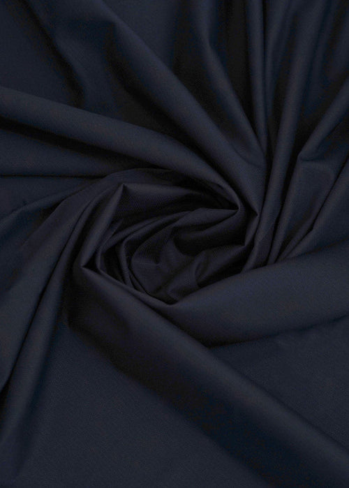 Navy blue dobby fabric with subtle woven texture, draped folds