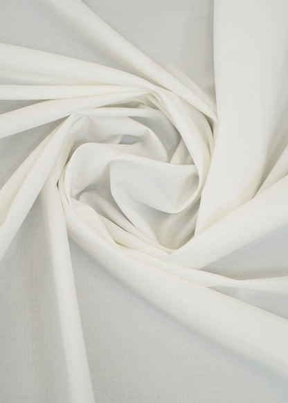 Off-white dobby fabric with woven texture, folded in soft folds
