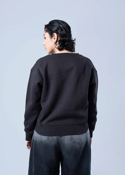 Black fleece crewneck sweatshirt, back view with ribbed hem