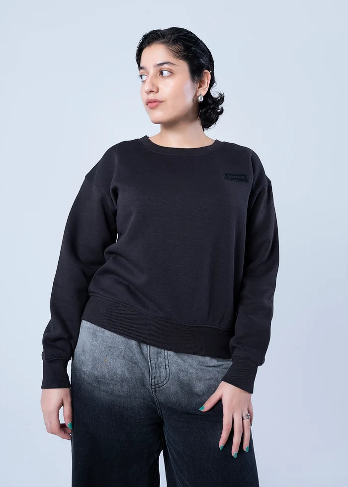 Black fleece crewneck sweatshirt with ribbed cuffs and hem, front torso view