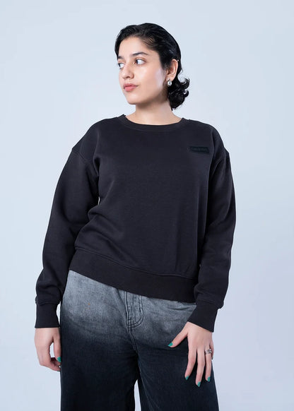 Black fleece crewneck sweatshirt with ribbed cuffs and hem, front torso view